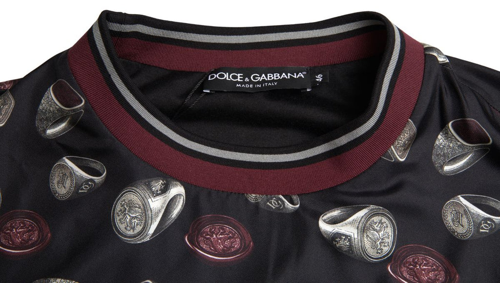 Pull en soie noir Dolce & Gabbana avec motif de bague, col rond, élégant et confortable pour un style sophistiqué.