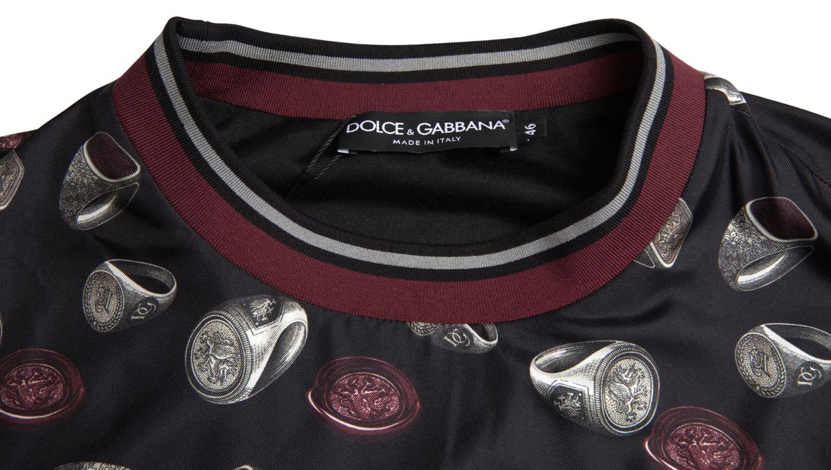 Pull en soie noir Dolce & Gabbana avec motif de bague, col rond, élégant et confortable pour un style sophistiqué.