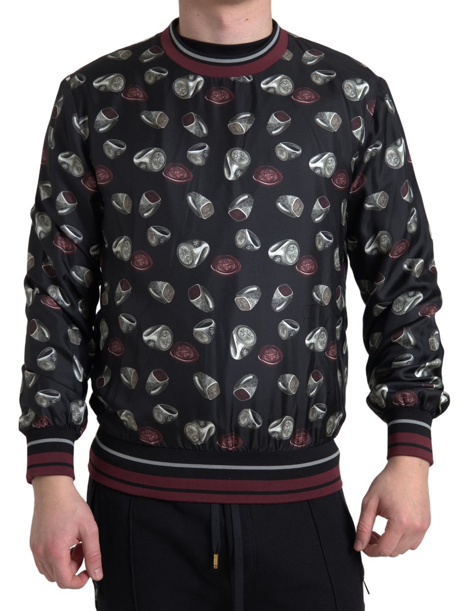 Pull en soie noir avec motif de bague Dolce & Gabbana, col rond et style élégant.