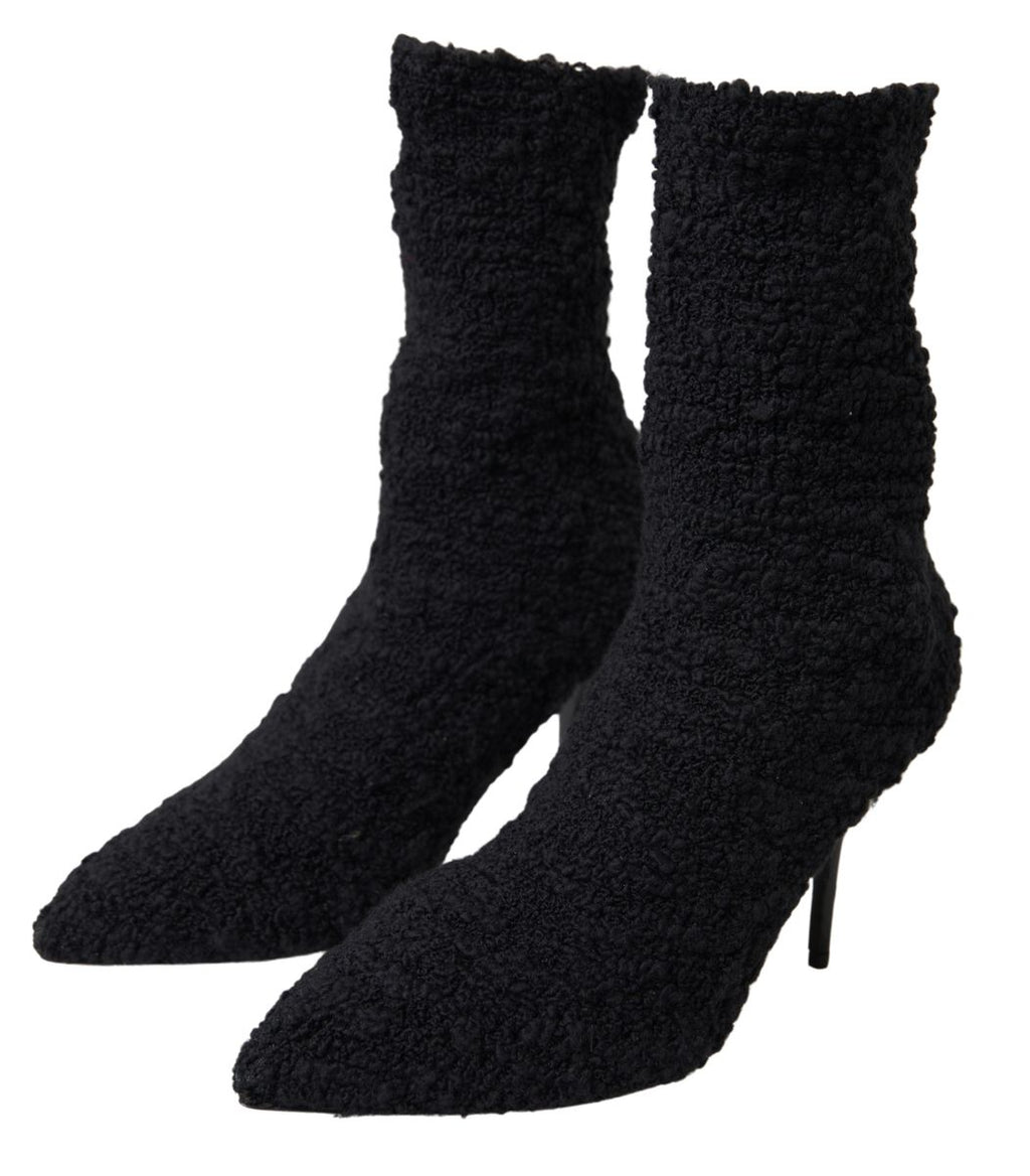 Chaussures Dolce & Gabbana à talons aiguilles noirs, bottines mi-mollet en cuir élégantes et sophistiquées.