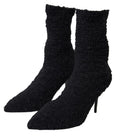 Chaussures Dolce & Gabbana à talons aiguilles noirs, bottines mi-mollet en cuir élégantes et sophistiquées.