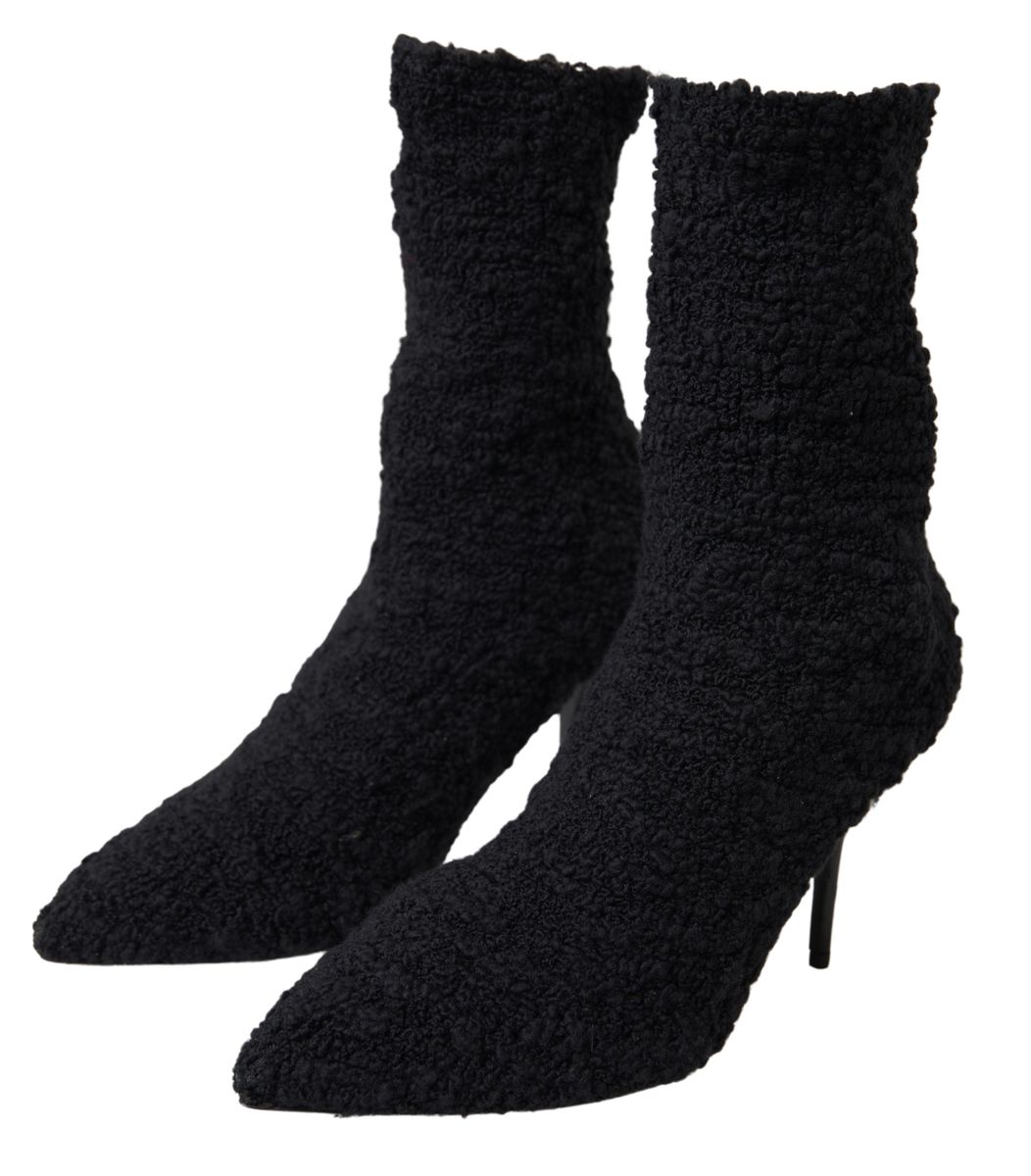 Chaussures Dolce & Gabbana à talons aiguilles noirs, bottines mi-mollet en cuir élégantes et sophistiquées.
