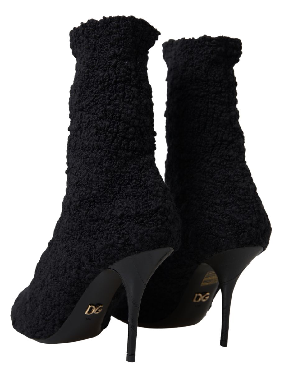 Chaussures Dolce & Gabbana talons aiguilles noires, bottines mi-mollet en cuir avec talons hauts élégants.