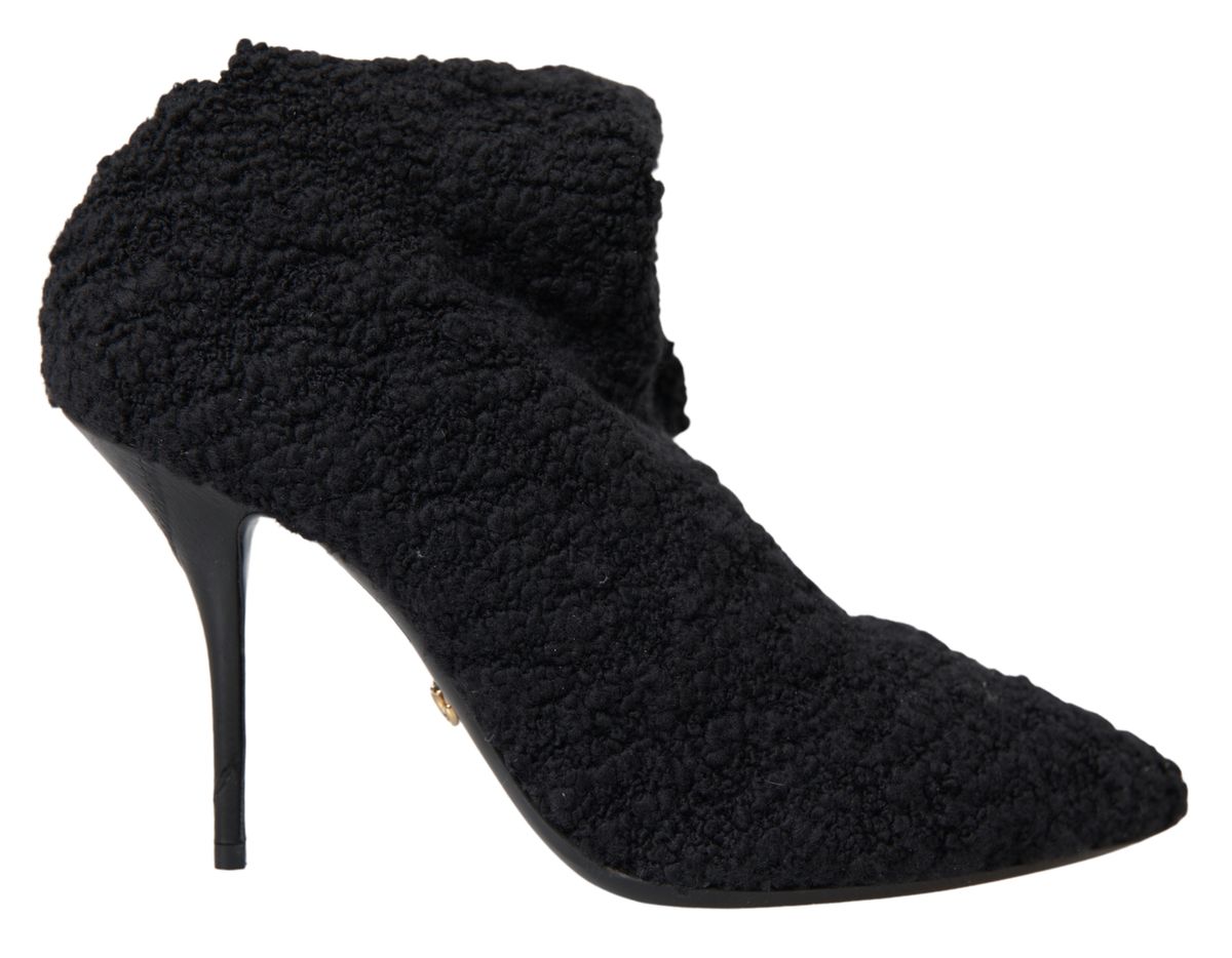 Escarpins noir Dolce & Gabbana à talons stilettos et bottines mi-mollet en cuir élégant.