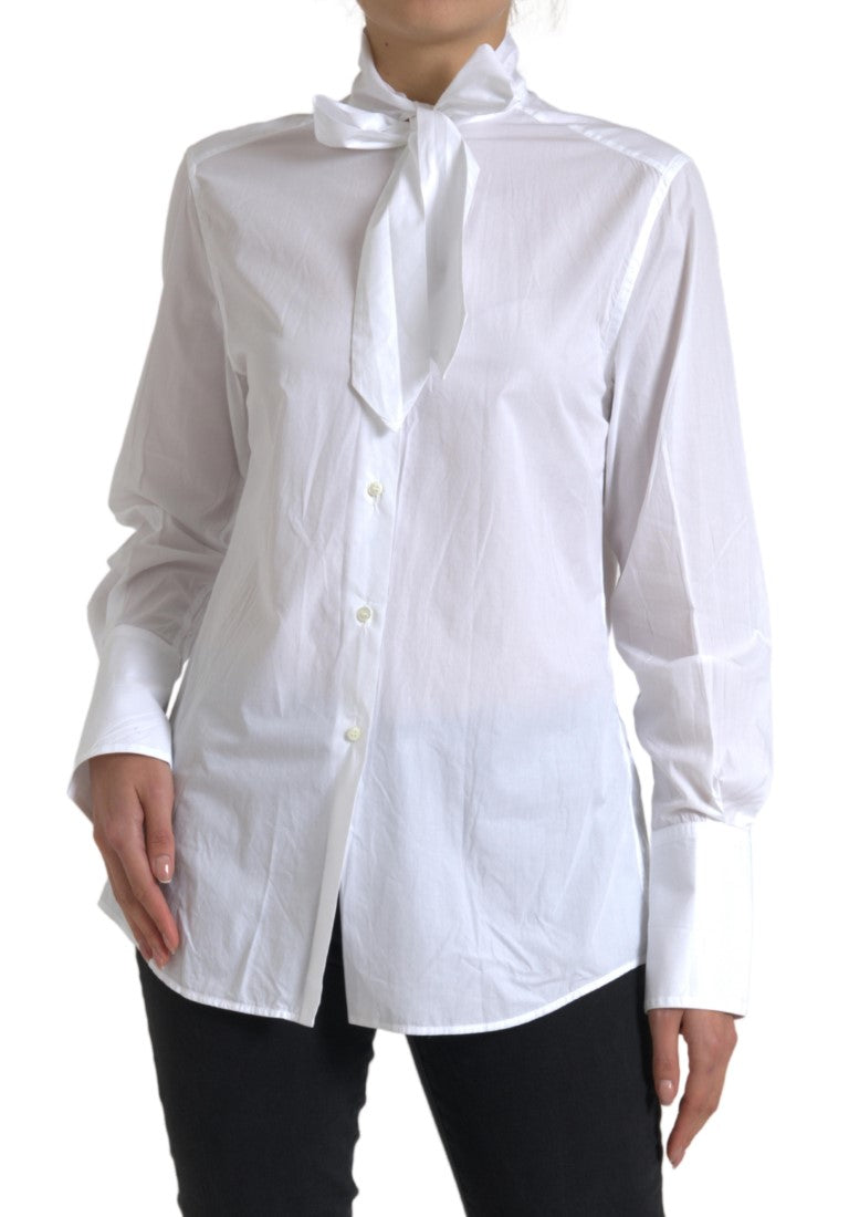Haut blanc en coton Dolce & Gabbana avec col ascot et manches longues, élégant et sophistiqué.