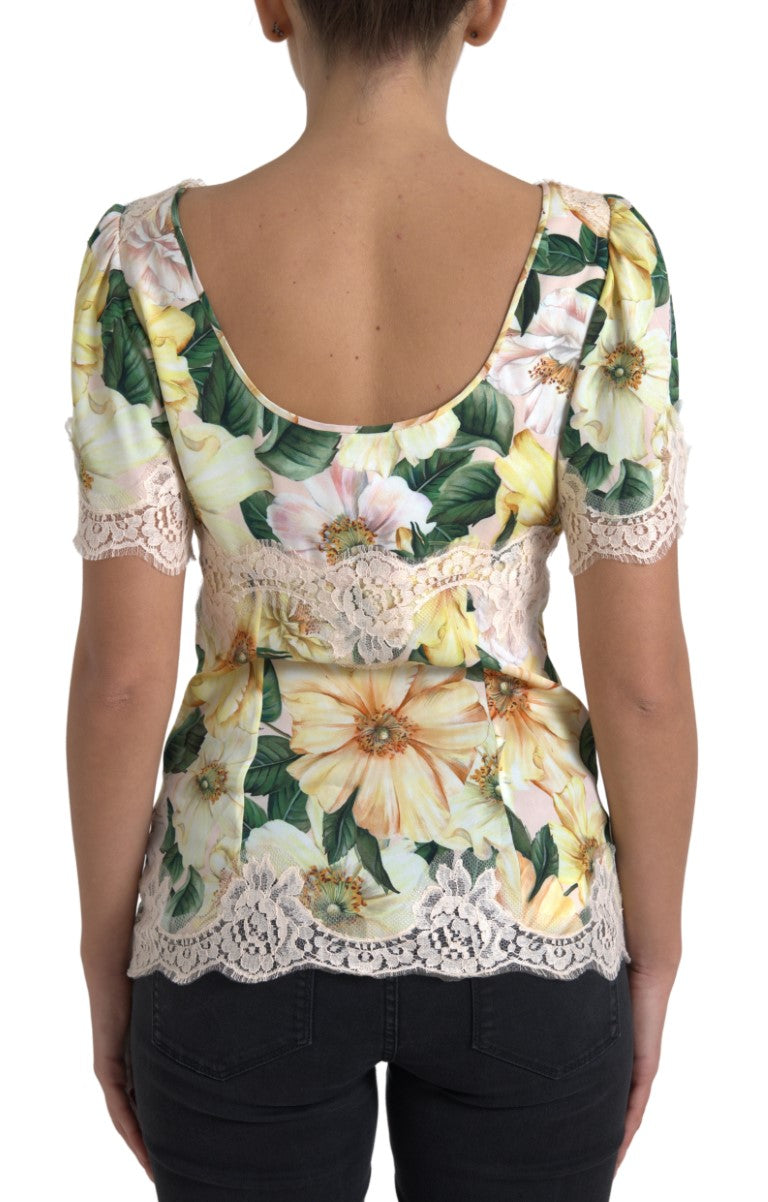 Blouse en dentelle florale multicolore avec décolleté en V de Dolce & Gabbana, style élégant et féminin.