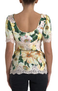 Blouse en dentelle florale multicolore avec décolleté en V de Dolce & Gabbana, style élégant et féminin.