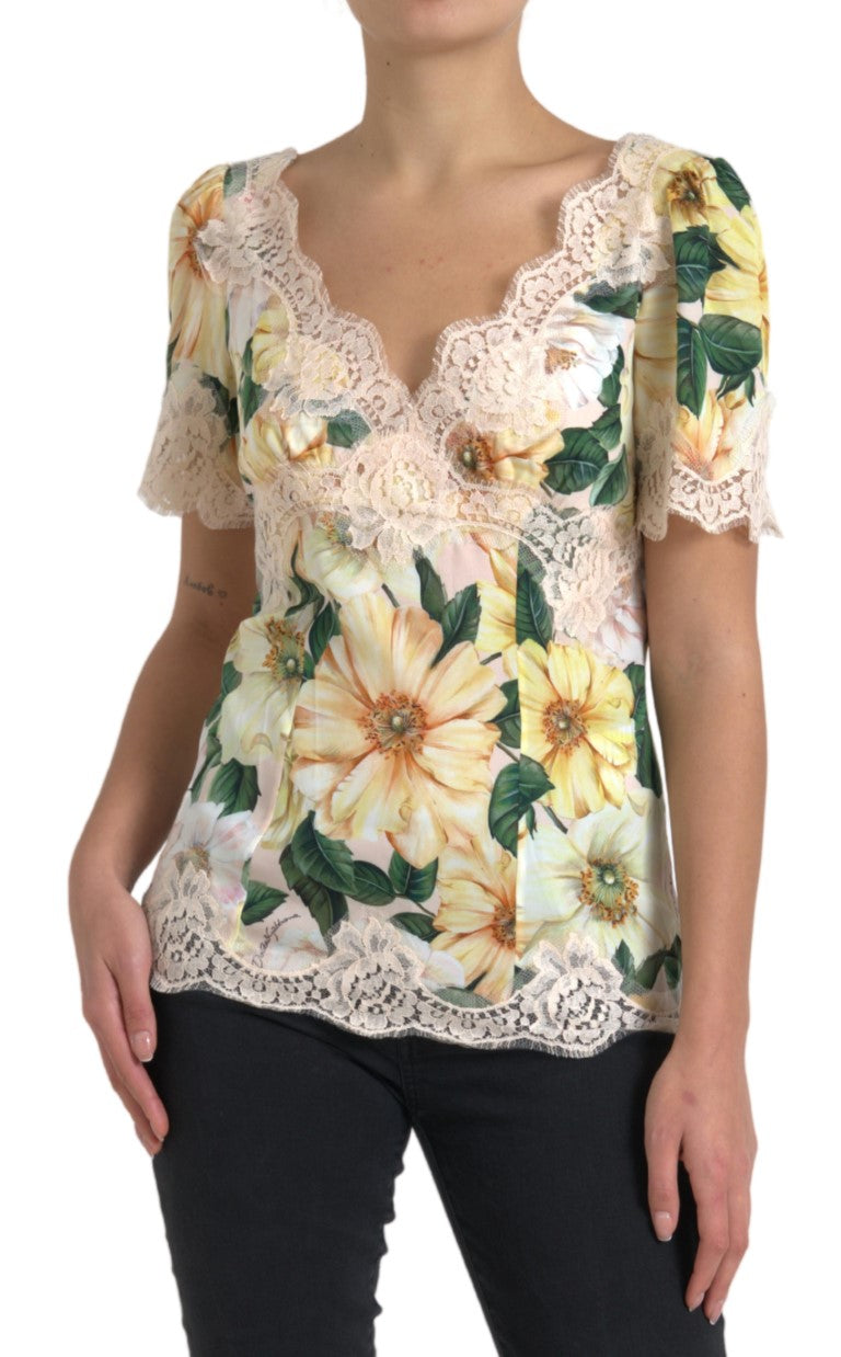 Blouse en dentelle à fleurs multicolores Dolce & Gabbana avec col en V, style élégant et féminin.