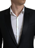 Veste blazer Martini en laine noire Dolce & Gabbana à un bouton, coupe classique et élégante.