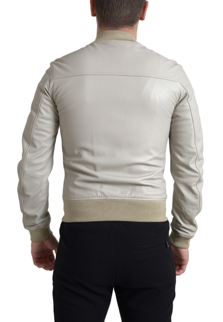 Veste bomber en cuir crème Dolce & Gabbana à fermeture éclair, style élégant et moderne, vue de face sur fond neutre.