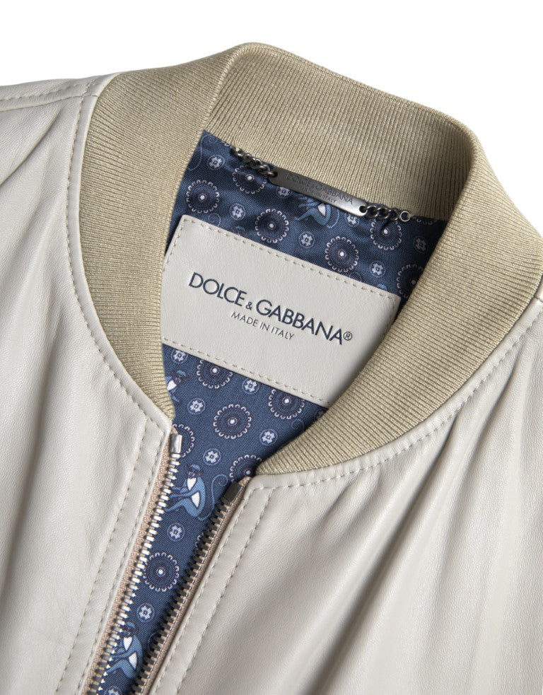 Veste bomber en cuir crème Dolce & Gabbana à fermeture éclair complète, style élégant et moderne, vue de face.