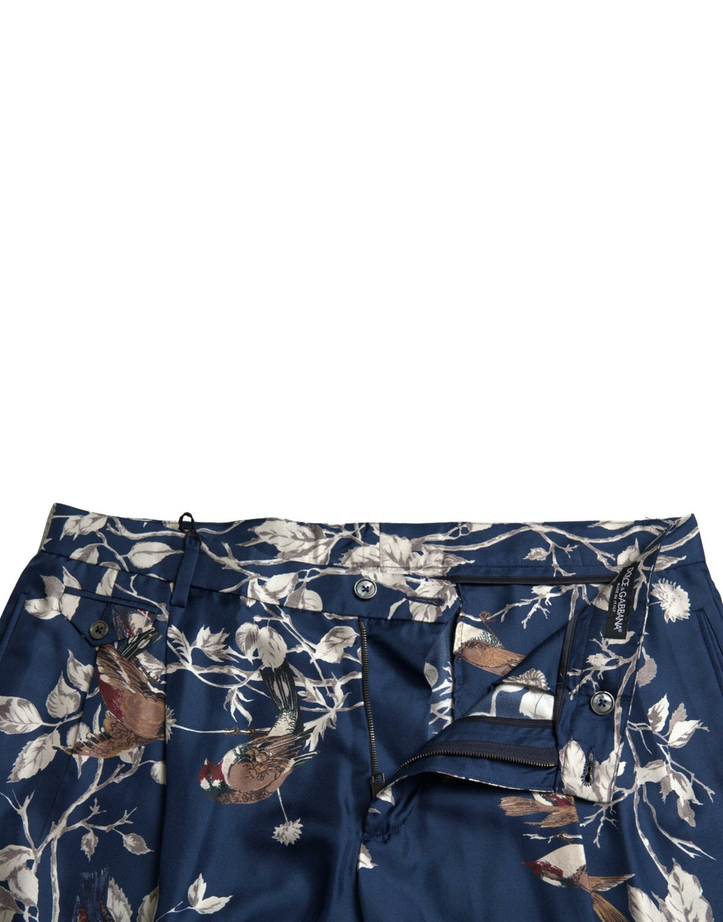 Shorts bermuda en soie à motifs floraux bleus de Dolce & Gabbana pour hommes, avec design élégant et tissu léger.