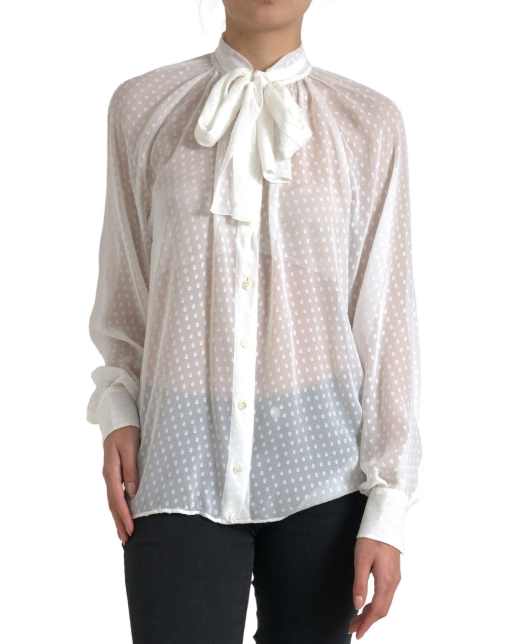Blouse en soie blanche Dolce & Gabbana à pois, transparente, avec un nœud au col, style élégant et féminin.