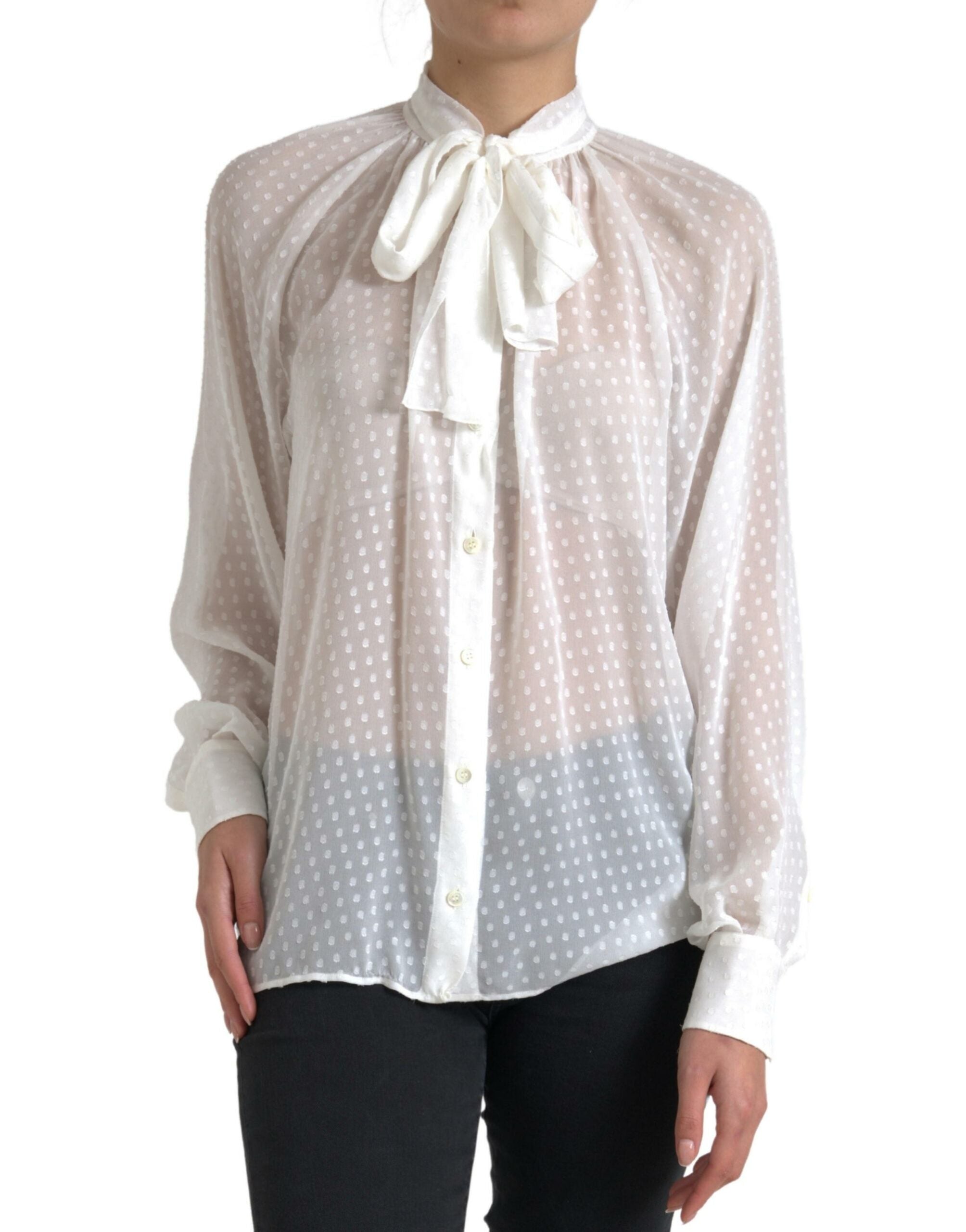 Blouse en soie blanche Dolce & Gabbana à pois, transparente, avec un nœud au col, style élégant et féminin.