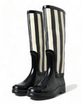 Bottes noires en caoutchouc Dolce & Gabbana, hautes et plates, chaussures élégantes pour femme.
