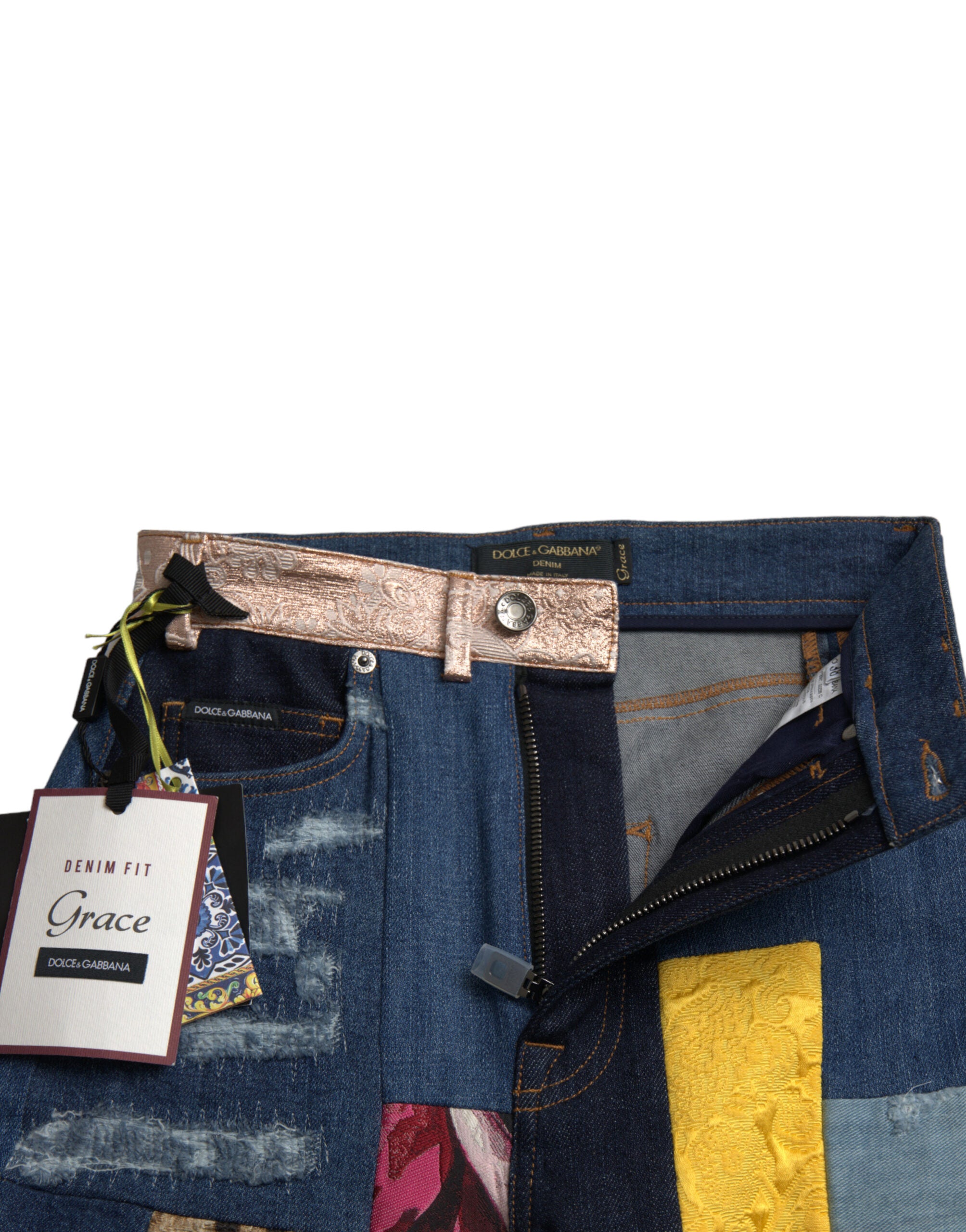 Jeans skinny en denim Dolce & Gabbana à patchworks multicolores, style gracieux et tendance, détails colorés visibles.
