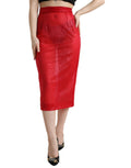 Jupe midi en tulle rouge à taille haute, coupe crayon, de la marque Dolce & Gabbana, conçue en tissu transparent et élégante.