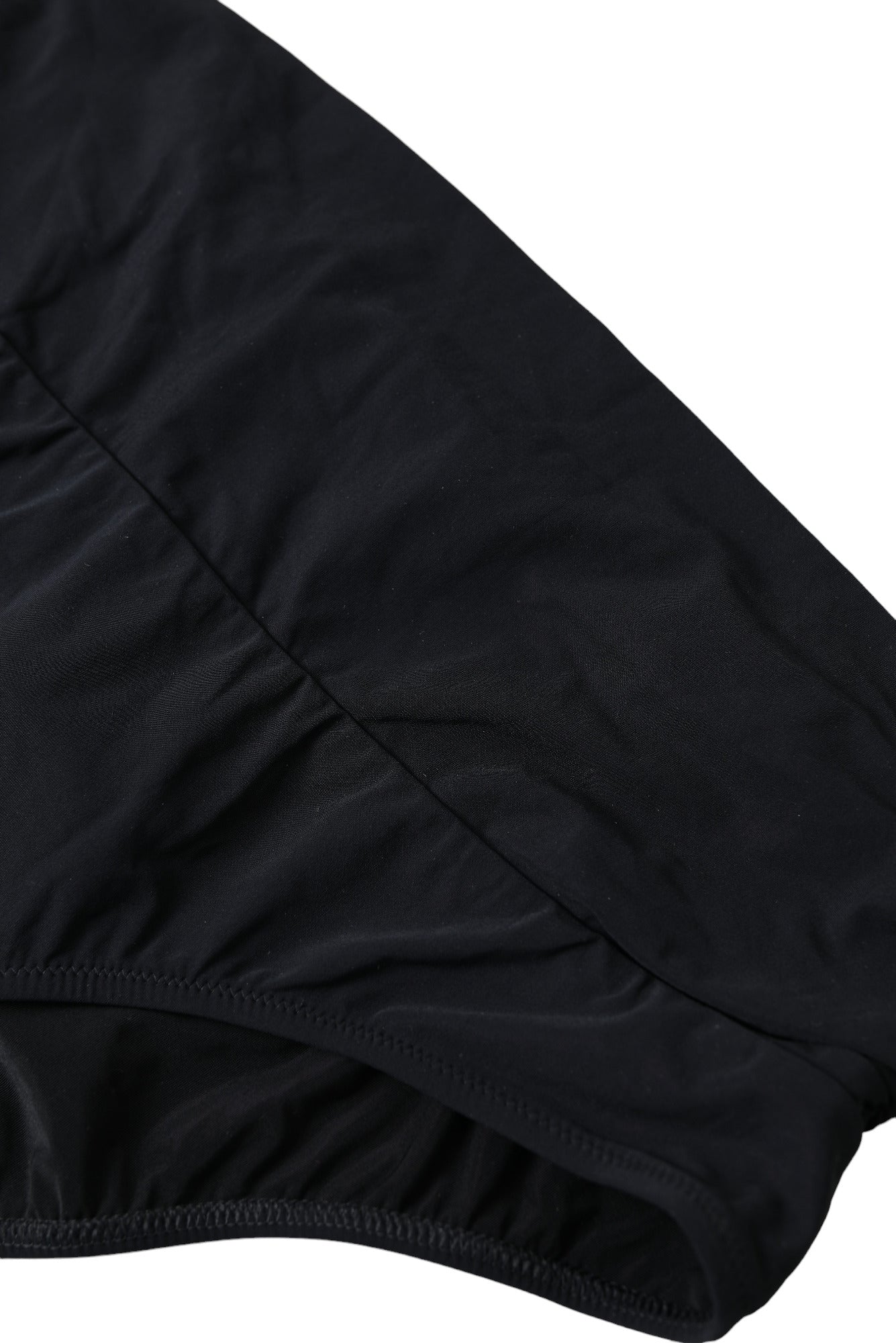 Bas de maillot de bain noir en nylon extensible Dolce & Gabbana, slip bikini élégant et ajusté.