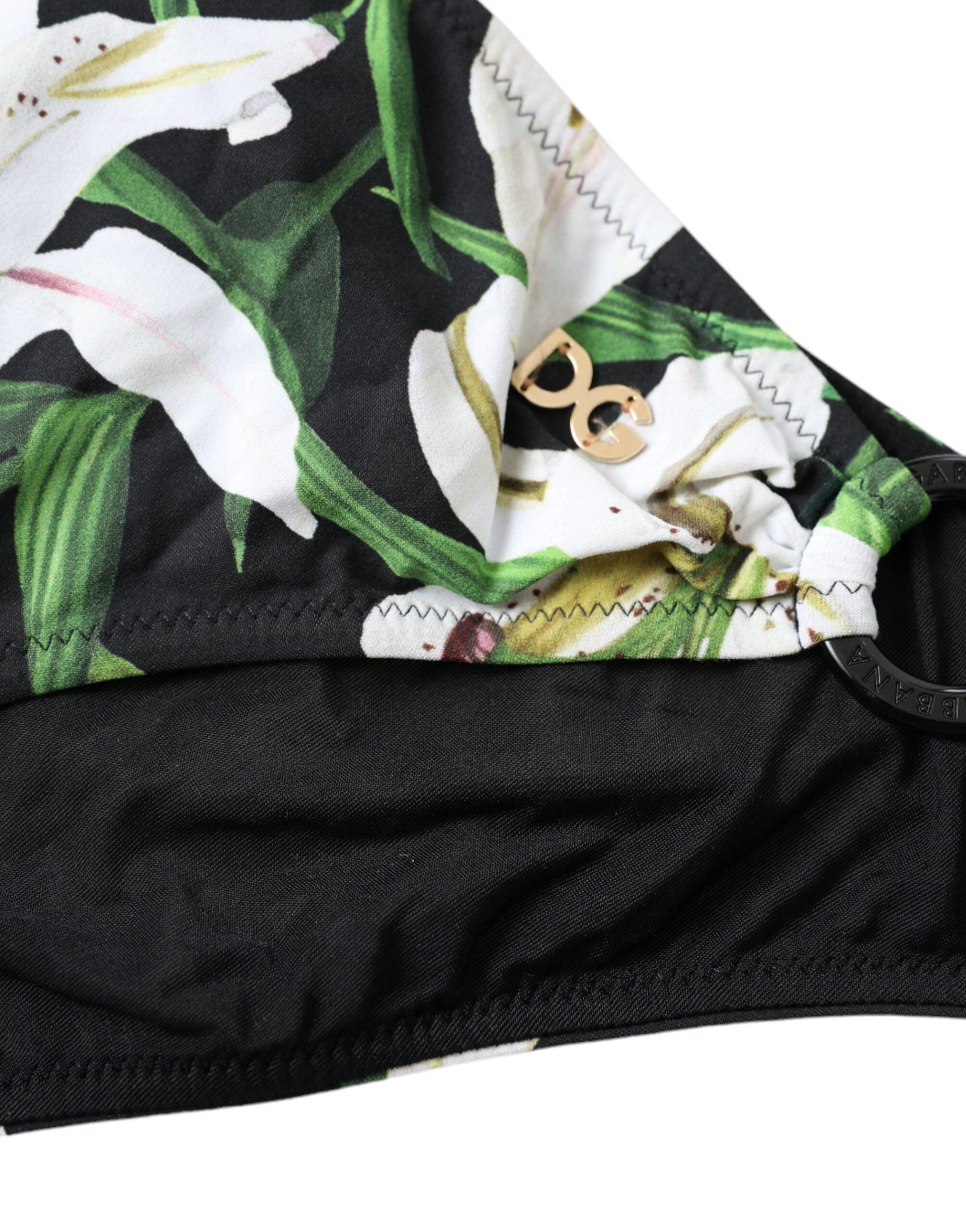 Bas de maillot de bain Dolce & Gabbana à imprimé lys noir, vêtement de plage élégant et confortable.
