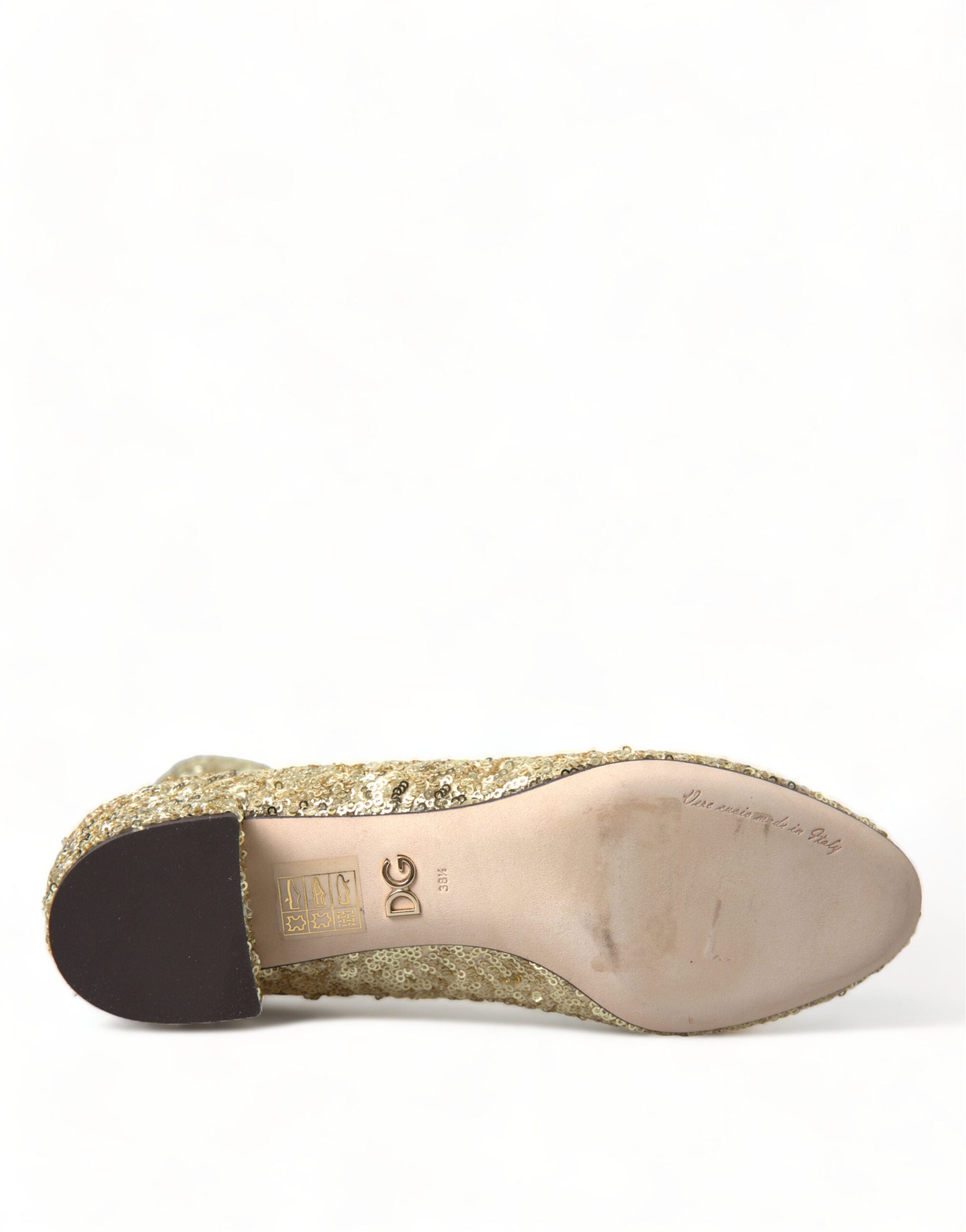 Bottes courtes dorées à sequins de Dolce & Gabbana, chaussures stretch élégantes avec finition brillante et style sophistiqué.