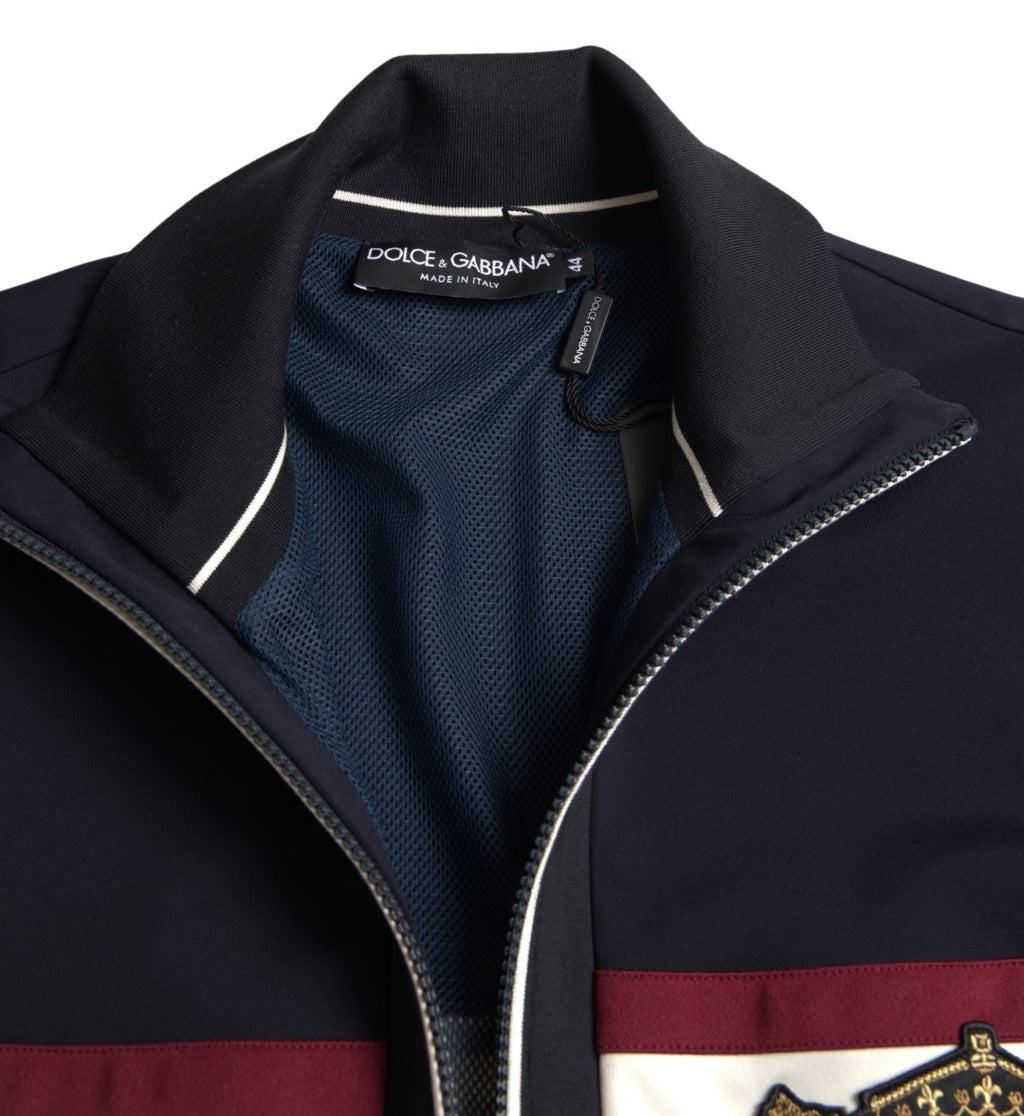 Cardigan bleu Dolce & Gabbana à fermeture éclair avec motif héraldique, manches longues et design élégant.