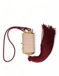 Trousse à maquillage mini en cuir exotique rose Dolce & Gabbana avec miroir intégré et tassel élégante.
