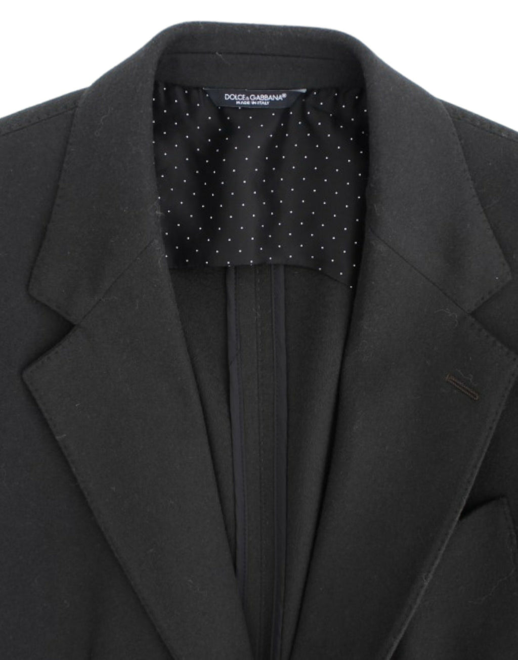 Veste en cachemire verte Dolce & Gabbana avec deux boutons, élégante et sophistiquée, détail du tissu et de la coupe.