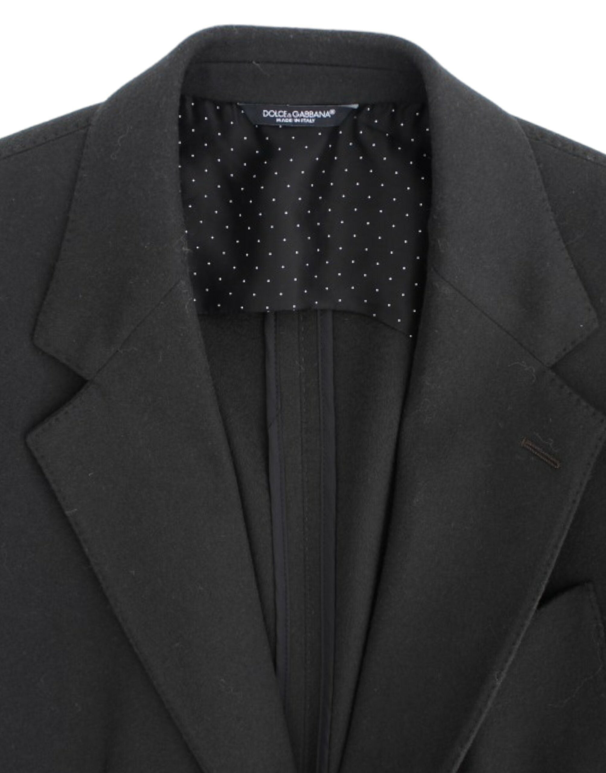 Veste en cachemire verte Dolce & Gabbana avec deux boutons, élégante et sophistiquée, détail du tissu et de la coupe.
