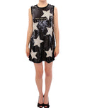 Robe fourreau noire Dolce & Gabbana Masterpiece avec étoiles en cristal Swarovski et détails brillants.
