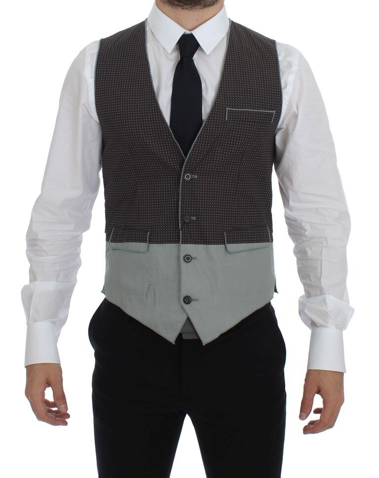 Gilet gris à pois Dolce & Gabbana pour femme, veste élégante avec motifs à pois, tissu sophistiqué, style moderne et chic.