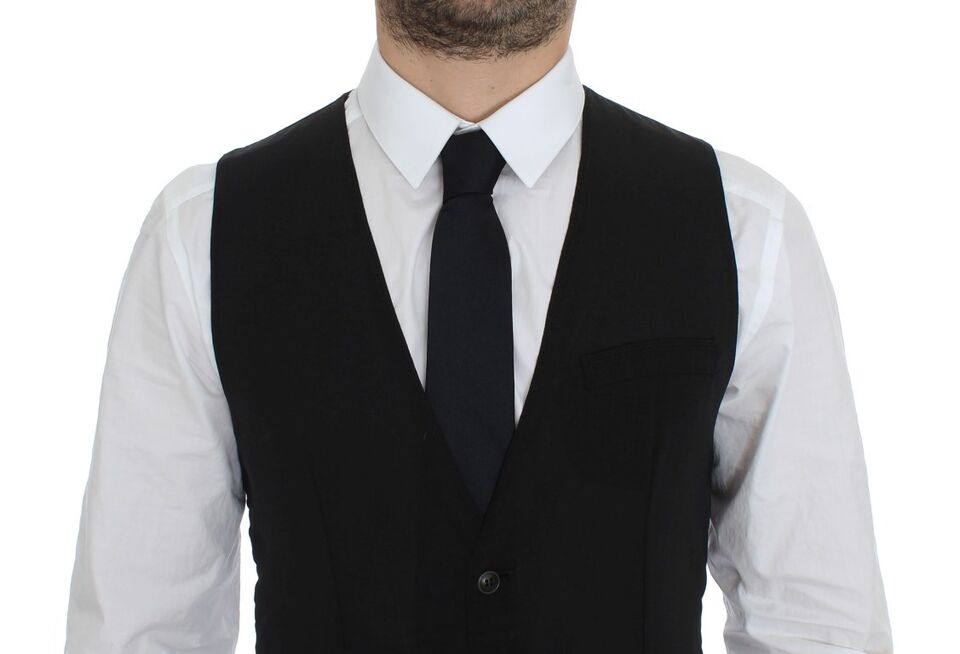 Gilet formel en laine noire de Dolce & Gabbana, veste élégante à col classique et coupe ajustée.
