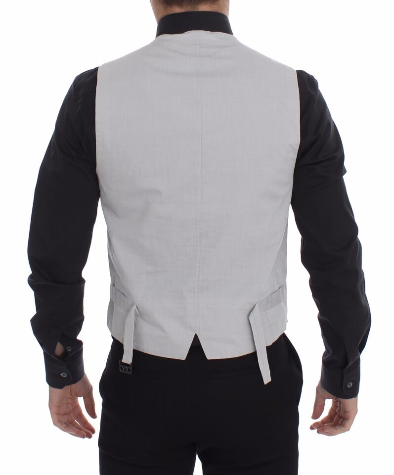 Robe habillée en soie beige de Dolce & Gabbana avec veste formelle en tissu mélangé, détails élégants pour occasion spéciale.