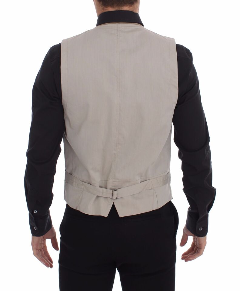 Gilet beige en coton de coupe slim, boutonnière frontale, de la marque Dolce & Gabbana, porté sur un mannequin.