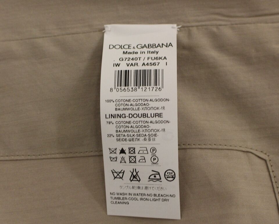 Gilet beige en coton Dolce & Gabbana, coupe slim, avec boutons sur le devant, porté sur un mannequin.