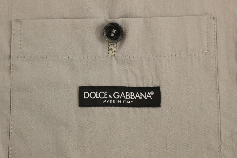 Gilet slim en coton gris de la marque Dolce & Gabbana avec boutons sur le devant, parfait pour un style élégant.