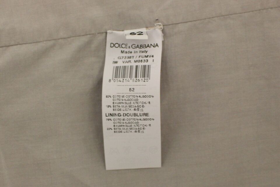 Veste sans manches Dolce & Gabbana en coton et soie beige, blazer élégante pour femme, détails de couture visibles.