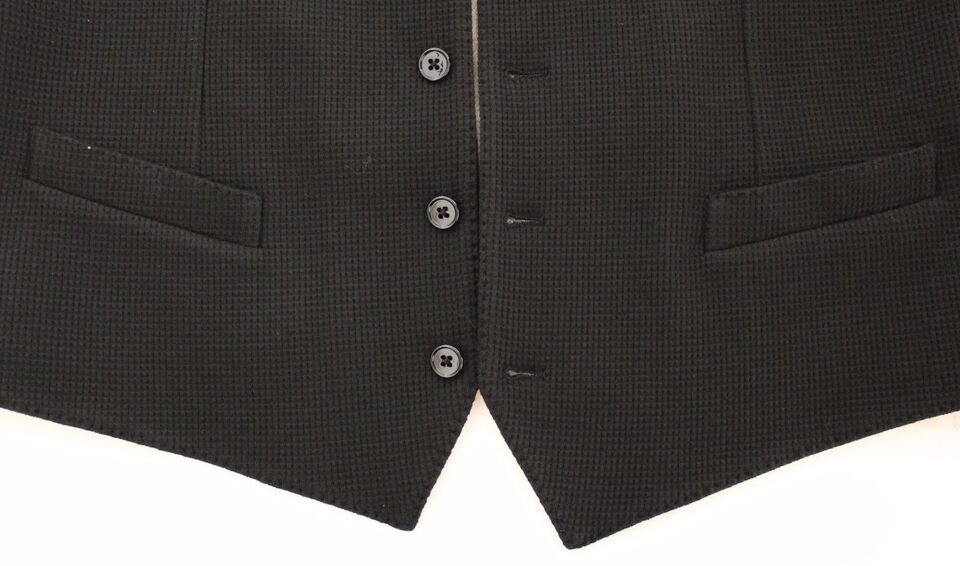Gilet blazer noir en coton Dolce & Gabbana, veste élégante avec coupe ajustée, porté en style sophistiqué.