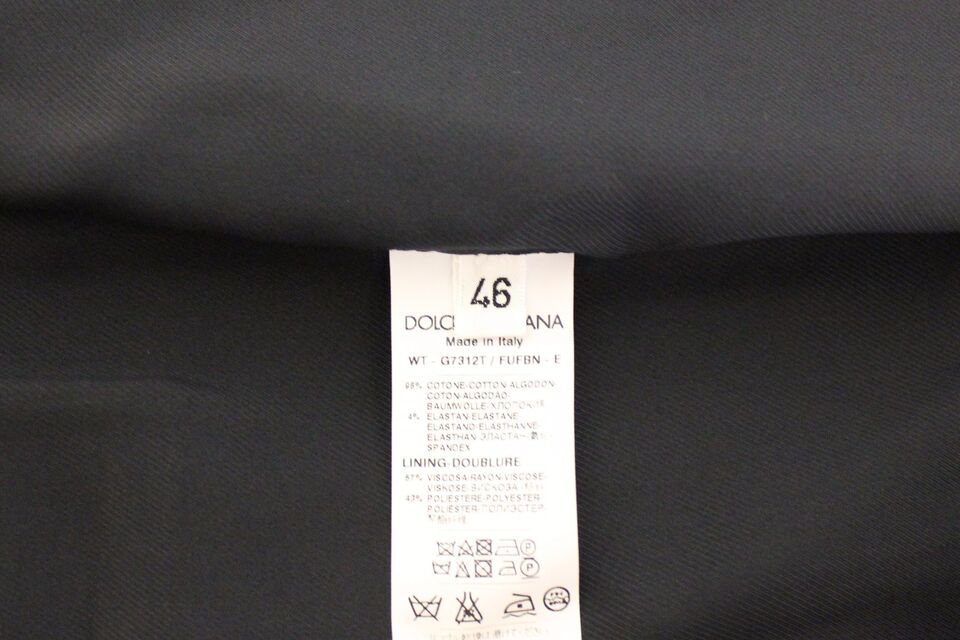 Veste blazer Dolce & Gabbana en coton stretch bleu, élégante et ajustée, portée sur un mannequin.