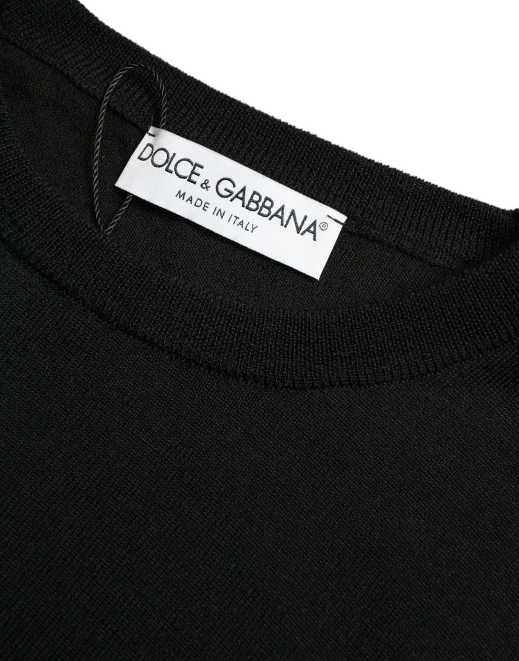 Pull Dolce & Gabbana en laine noire à col rond, vêtement élégant pour homme, visible en détail sur l'image.