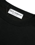 Pull Dolce & Gabbana en laine noire à col rond, vêtement élégant pour homme, visible en détail sur l'image.