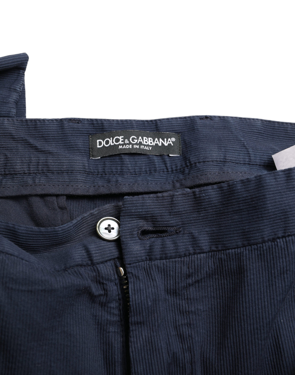 Pantalon de costume slim fit en coton stretch bleu foncé de Dolce & Gabbana, visible avec une coupe élégante et tissu confortable.