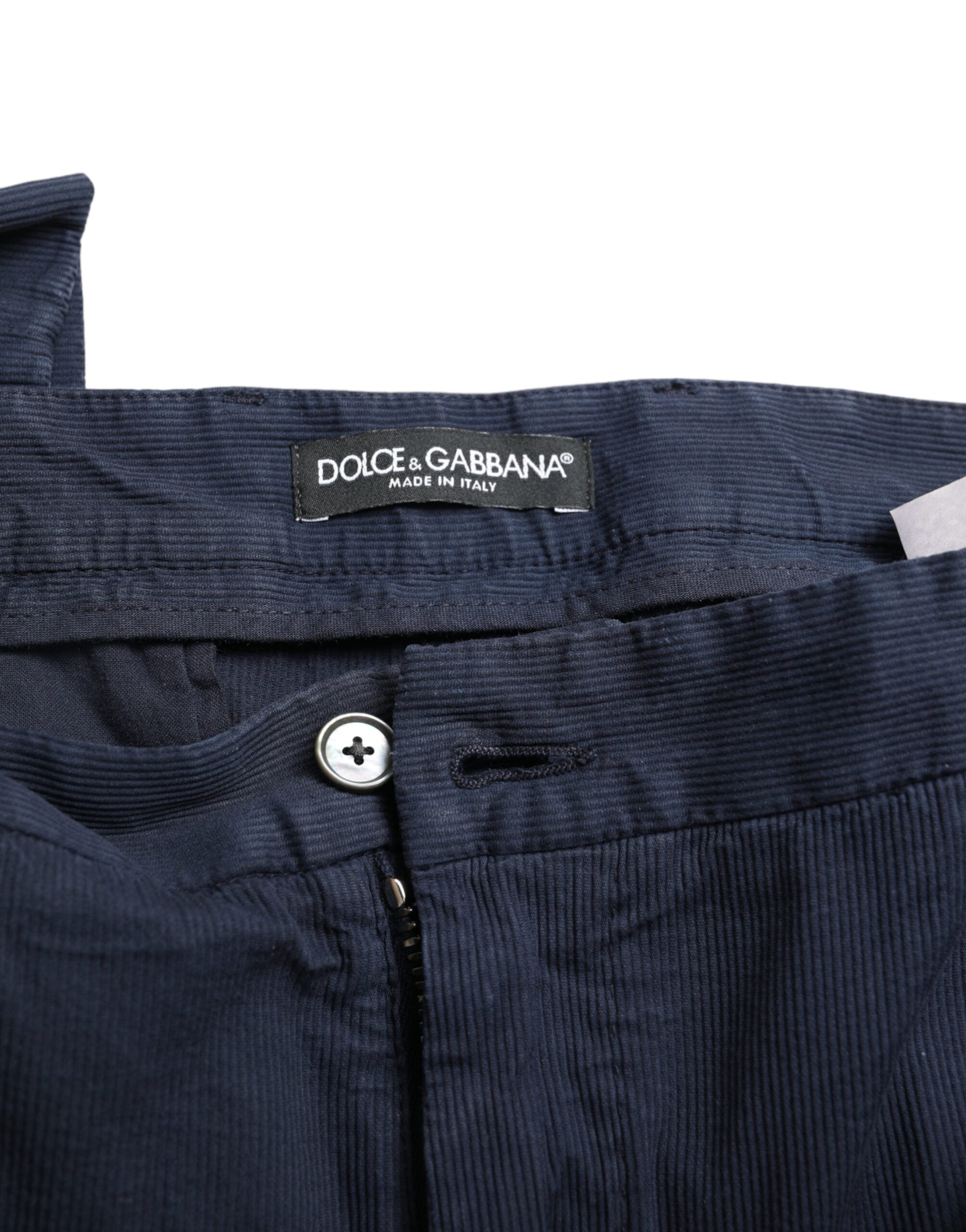 Pantalon de costume slim fit en coton stretch bleu foncé de Dolce & Gabbana, visible avec une coupe élégante et tissu confortable.