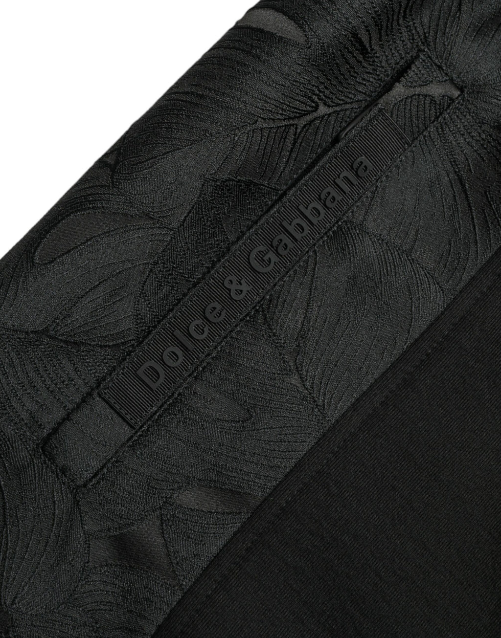 Pantalon jogger slim en coton noir Dolce & Gabbana avec taille élastique et poches, ajusté et confortable.