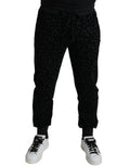 Pantalons joggers slim fit en coton noir avec motif léopard de Dolce & Gabbana, élégants et confortables.