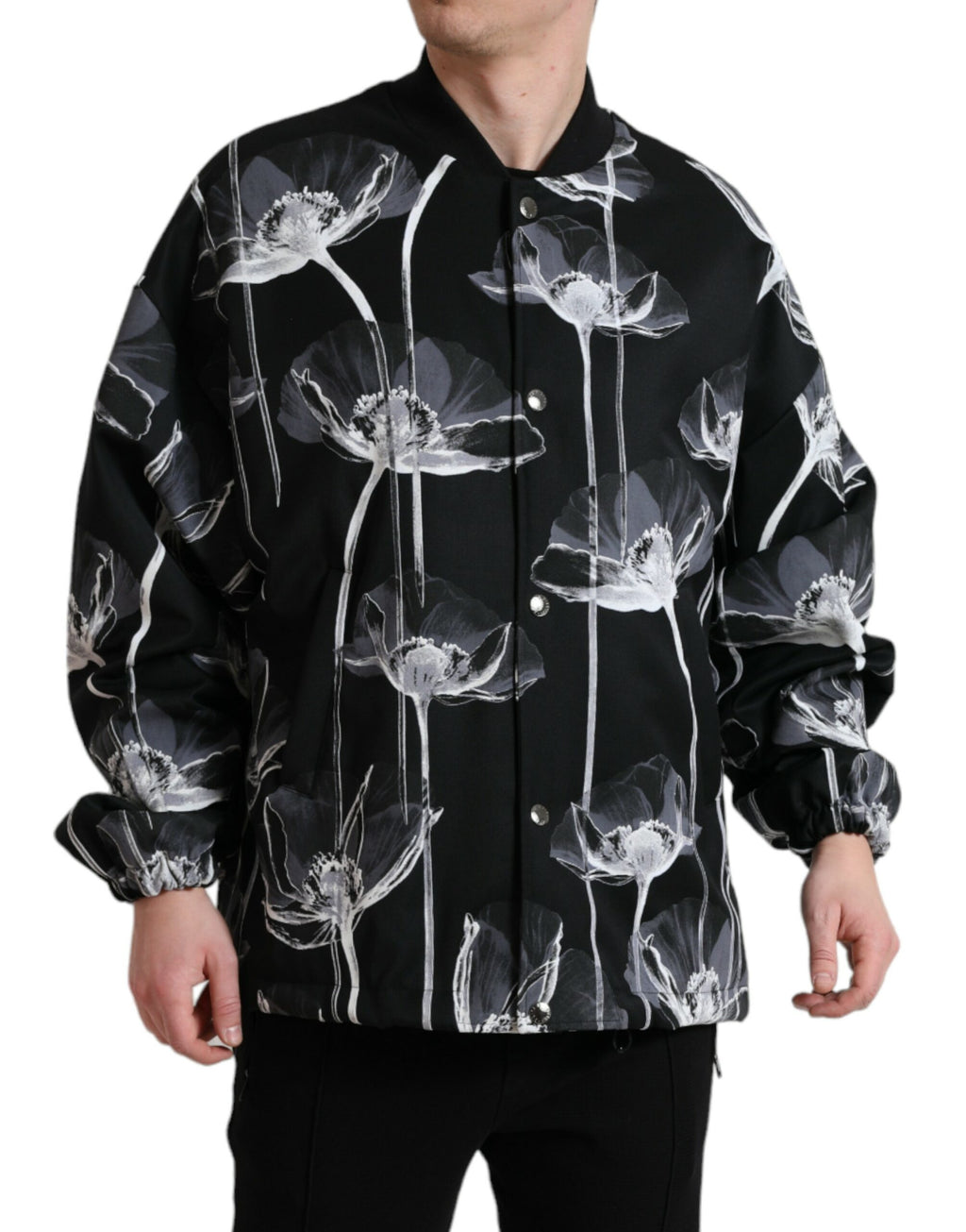 Veste bomber en laine noire à fleurs Dolce & Gabbana, avec boutons, style élégant et moderne.