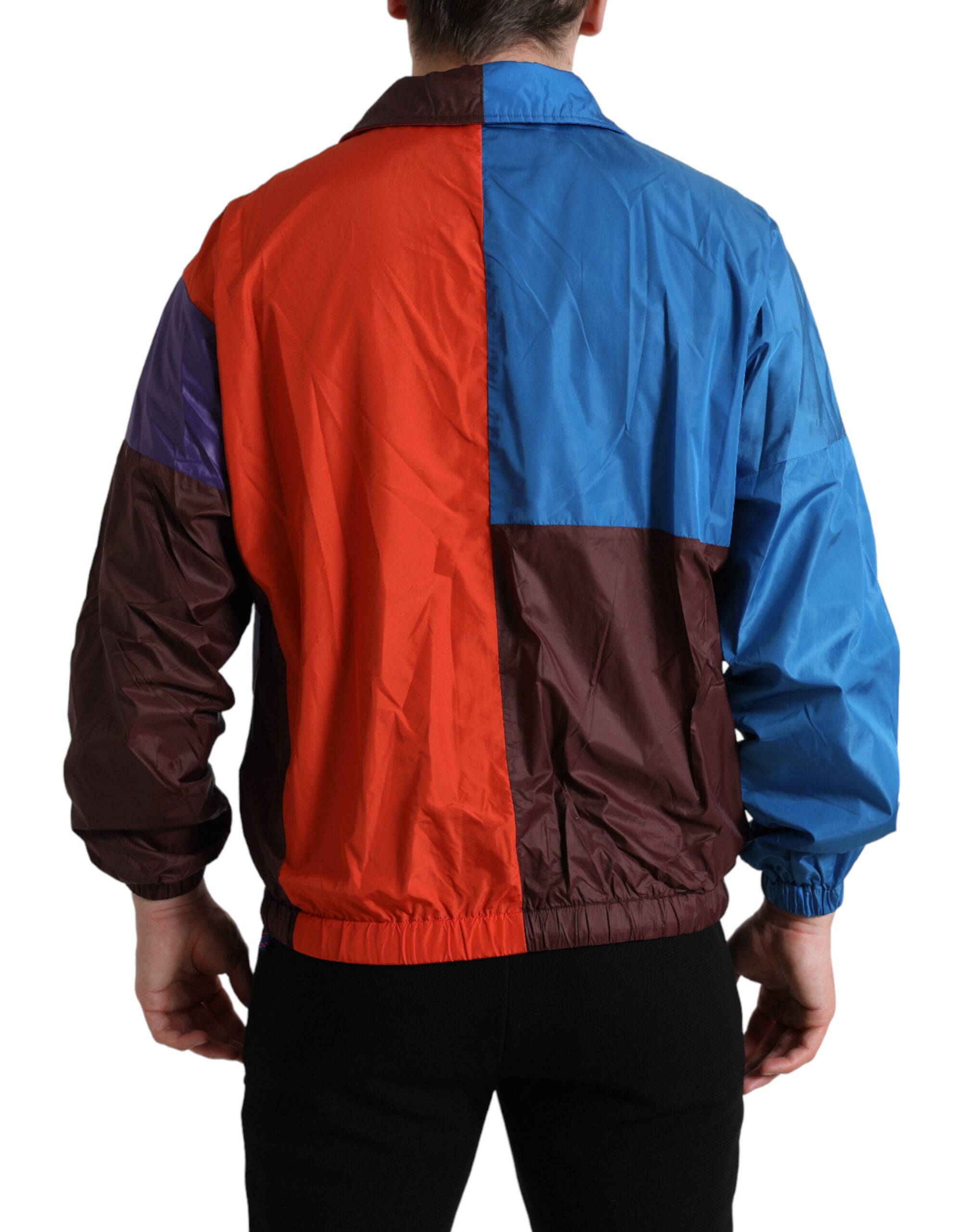 Veste coupe-vent multicolore Dolce & Gabbana, style décontracté avec motifs colorés, tissu léger et design moderne.