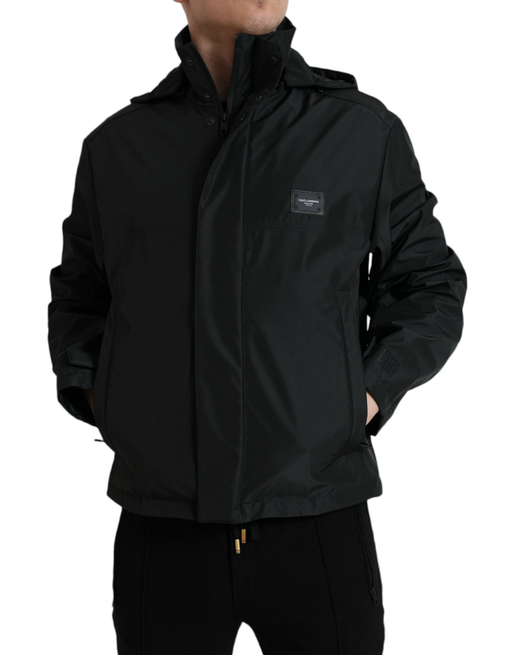 Veste à capuche noire en polyester Dolce & Gabbana avec logo en plaque, manches longues et design élégant.