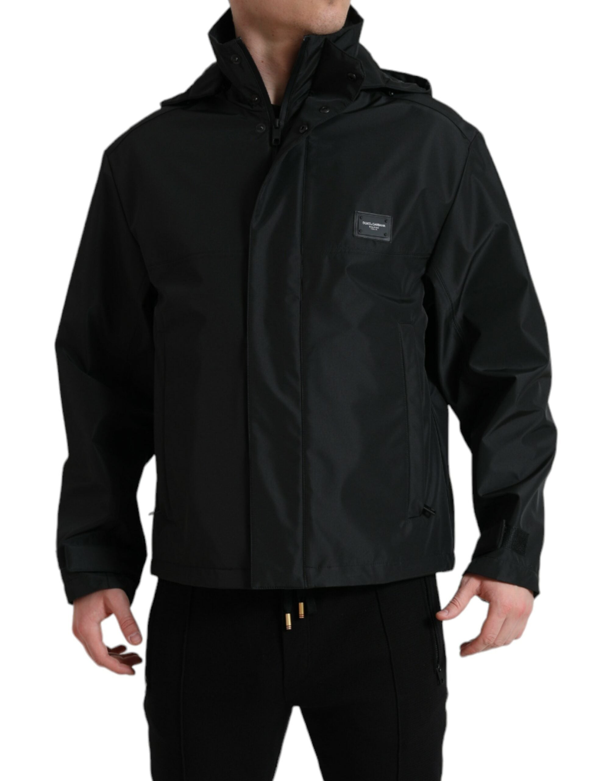 Veste à capuche en polyester noir Dolce & Gabbana avec plaque logo, détails de style élégant et moderne.