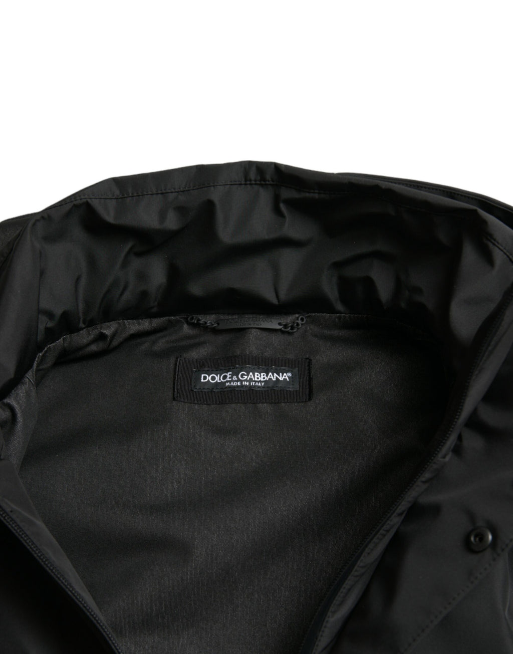 Veste à capuche en polyester noir Dolce & Gabbana avec logo en plaque, décontractée et élégante, visible sur l'image.