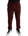 Pantalon de pyjama en soie rouge bivoie avec motif couronne Dolce & Gabbana, style élégant et confortable.
